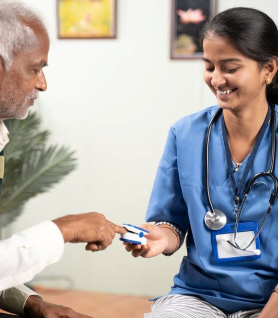 Nurse checking an older patient's health